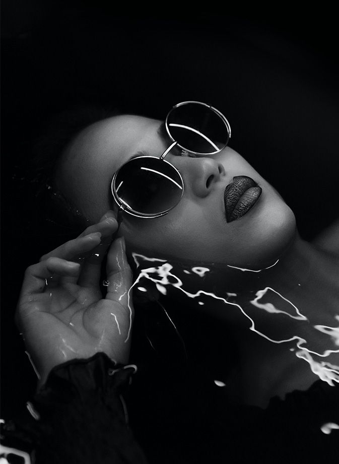 Fashion model submerged in water