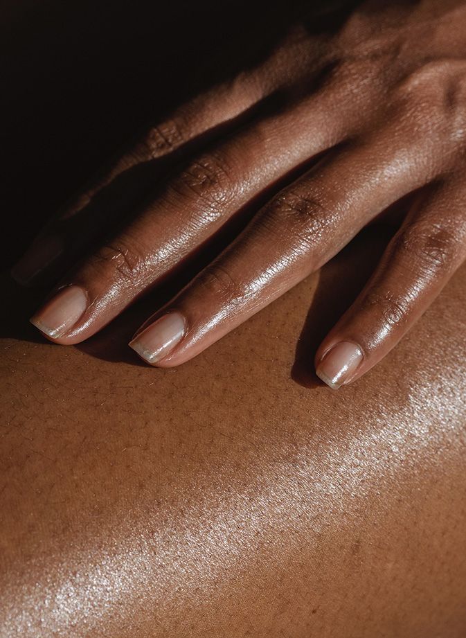 Close up of hand on thigh